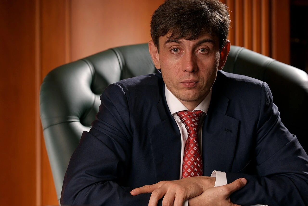 Portrait of Sergey Nikolayevich Galitsky seated in a suit and red tie.