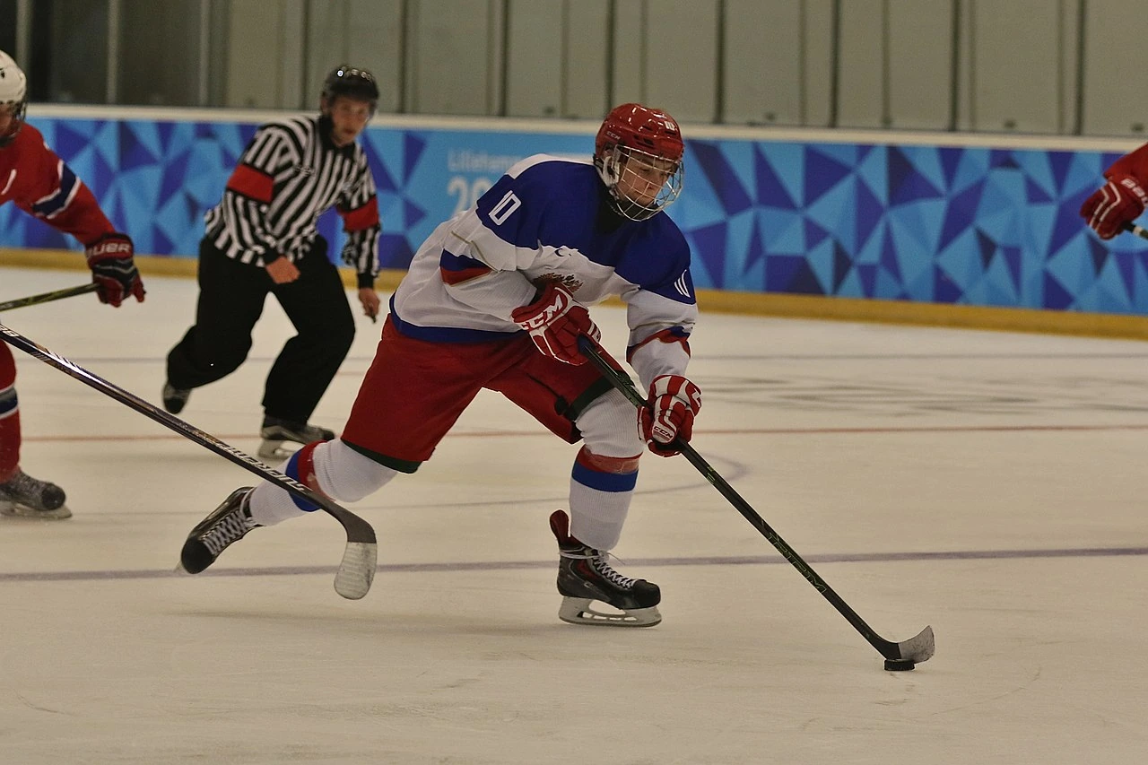 Andrei Svechnikov skating with the puck during an ice hockey game