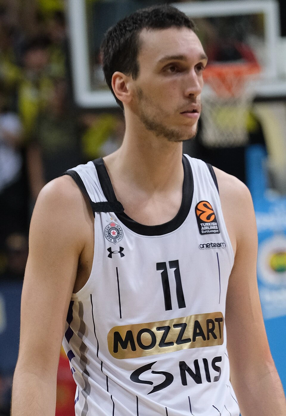 Aleksej Pokuševski in a KK Partizan basketball jersey during a EuroLeague game